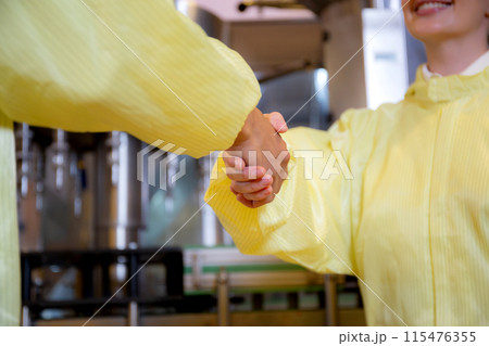 Two young worker man and woman handshake about agreement for success. 115476355
