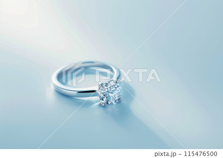 A diamond ring is on a table on a bright background 115476500