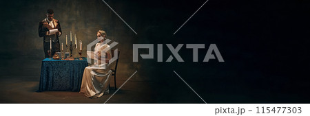 Man and woman in period attire, Viscount and Viscountess writing letters against dark vintage background 115477303