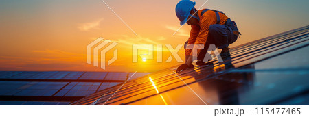 A technician is installing solar panels at a photovoltaic power station. 115477465