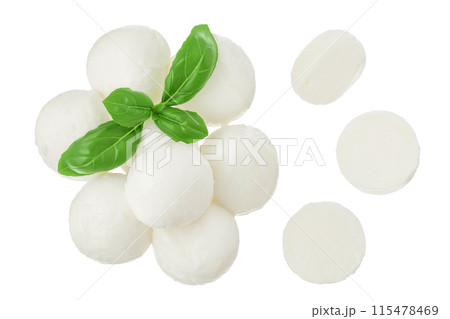 Mini mozzarella balls with basil leaf isolated on white background. Top view. Flat lay. Mini mozzarella balls with basil leaf isolated on white background. Top view. Flat lay. 115478469
