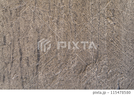 The old greasy dusty rough background of the wall of the building is grayish brown. Creates the impression of desolation, aging, abandoned dwelling, abandoned living space, blank for text. The old greasy dusty rough background of the wall of the building is grayish brown. Creates the impression of desolation, aging, abandoned dwelling, abandoned living space, blank for text. 115478580