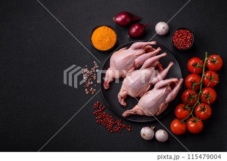 Whole raw quails with salt, spices and herbs on a dark concrete background Whole raw quails with salt, spices and herbs on a dark concrete background 115479004