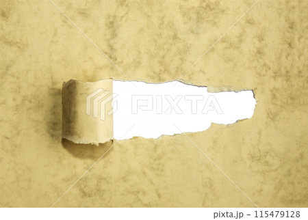 Old Ripped paper with curled edges.  115479128