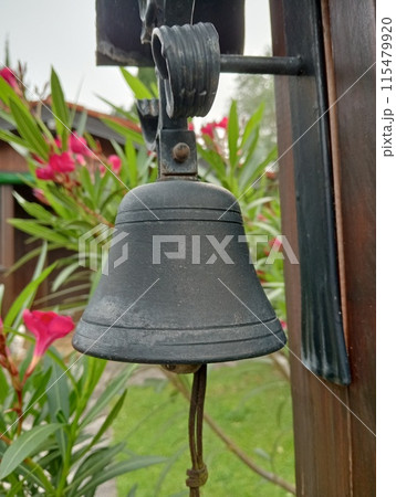 small bell with flowers in a garden small bell with flowers in a garden 115479920