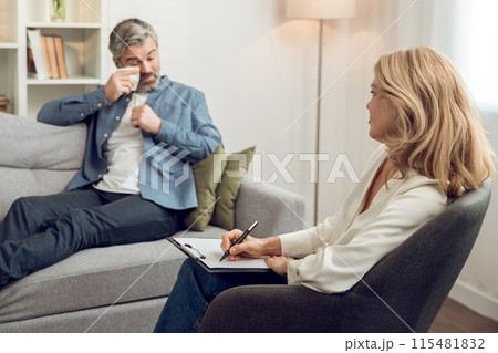 Caucasian female psychologist listening attentively to her patient's confession offering advice and counseling Caucasian female psychologist listening attentively to her patient's confession offering advice and counseling 115481832