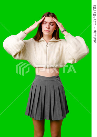 Woman in Skirt Holding Hands to Her Head 115485788