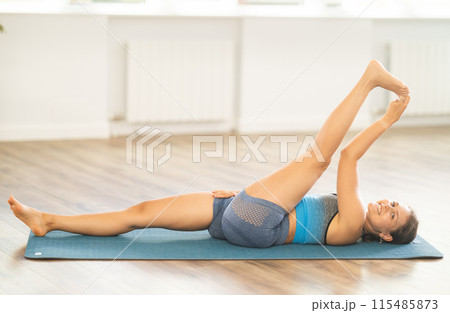 Different yoga poses performed by a slender girl in gym 115485873