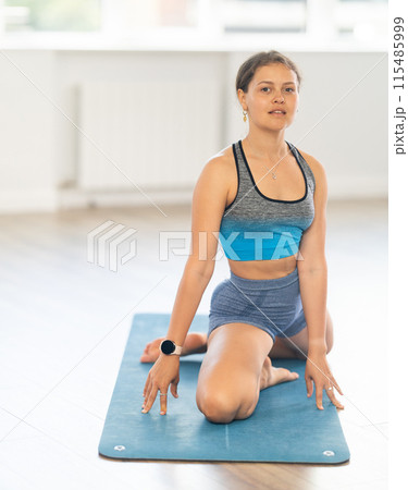 Different yoga poses performed by a slender girl in gym Different yoga poses performed by a slender girl in gym 115485999