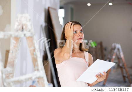 Portrait of tired woman in apartment during repair works 115486137