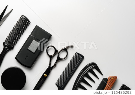 Set of barber tools for haircut on gray background flat lay Set of barber tools for haircut on gray background flat lay 115486292
