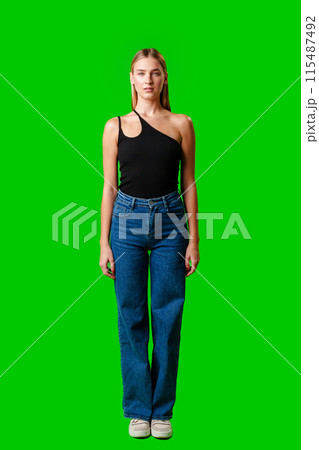 Blonde Woman in Black Tank Top Posing for Picture Blonde Woman in Black Tank Top Posing for Picture 115487492