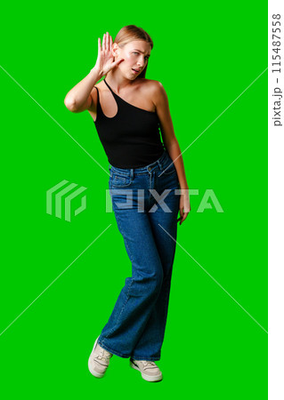 Young Woman in Black Top Holding Hand to Ear 115487558