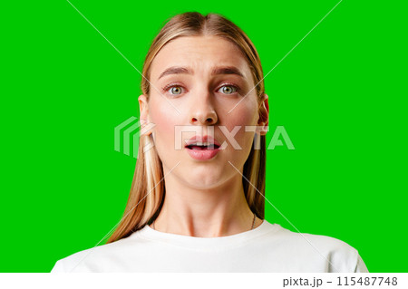 Young Woman in White T-shirt Making a Surprised Face 115487748