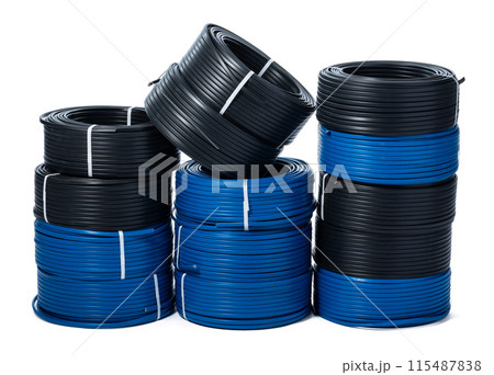 Coils of black and blue cable isolated on white background Coils of black and blue cable isolated on white background 115487838