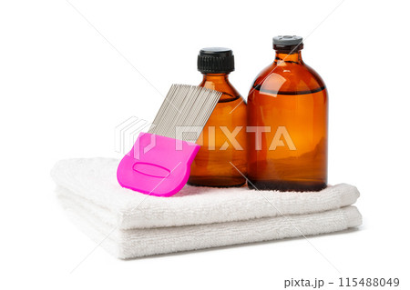 Comb, anti lice medicine and towel on white background 115488049