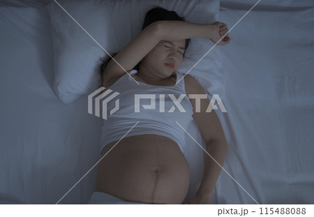 Depressed lonely Asian pregnant divorce woman in bedroom at home. Having a baby. Family people lifestyle. Mom. 115488088