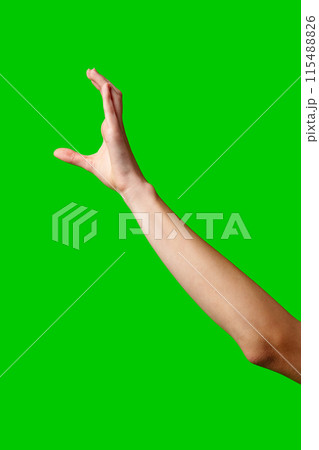 A womans hand extends upward into the air, fingers outstretched, reaching upward towards an unseen destination. 115488826