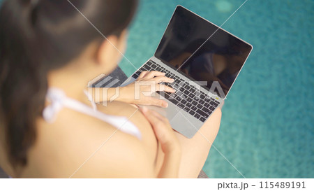 A portrait of happy Asian pregnant woman by the swimming pool. People lifestyle in travel holiday vacation concept. Relaxation. Having a baby. Family people lifestyle. Mom love. 115489191