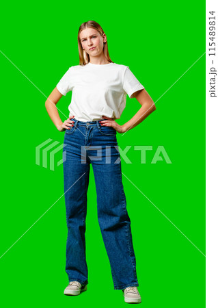 Young Woman With Pursed Lips Expressing Skepticism Against Green Screen Background 115489814