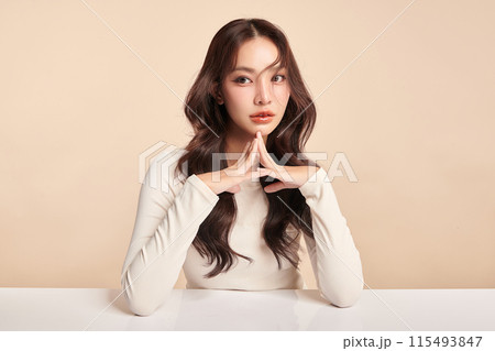 Beautiful young asian woman with clean fresh skin on beige background, Face care, Facial treatment, Cosmetology, beauty and spa, Asian women portrait. Beautiful young asian woman with clean fresh skin on beige background, Face care, Facial treatment, Cosmetology, beauty and spa, Asian women portrait. 115493847