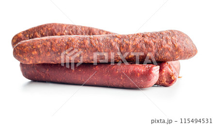 Smoked salami sausages isolated on white background. 115494531
