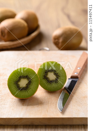 Fresh kiwi fruit cutting on wooden board, Healthy eating 115497411