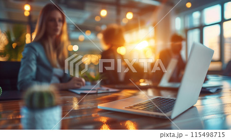 Focused and driven, a team of creatives collaborates over a laptop, exploring new ideas in their contemporary office setting Focused and driven, a team of creatives collaborates over a laptop, exploring new ideas in their contemporary office setting 115498715