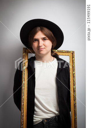 Artistic portrait, frame within a frame, young woman. Beyond the frame, emotional studio shot, creative portrait. Woman in 20s, artistic expression, framed sadness Artistic portrait, frame within a frame, young woman. Beyond the frame, emotional studio shot, creative portrait. Woman in 20s, artistic expression, framed sadness 115499191