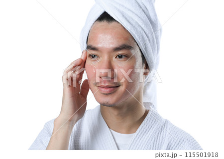 Handsome asian man applying facial cream isolate on white background. Self care concept 115501918
