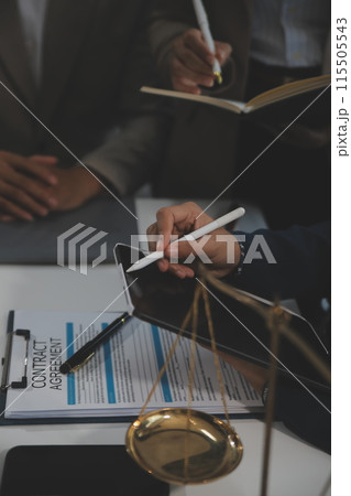 Judge gavel with Justice lawyers having team meeting at law firm background. Concepts of Law and Legal services. Judge gavel with Justice lawyers having team meeting at law firm background. Concepts of Law and Legal services. 115505543
