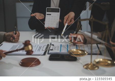 Judge gavel with Justice lawyers having team meeting at law firm background. Concepts of Law and Legal services. 115505545