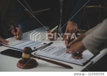 Judge gavel with Justice lawyers having team meeting at law firm background. Concepts of Law and Legal services. 115505554