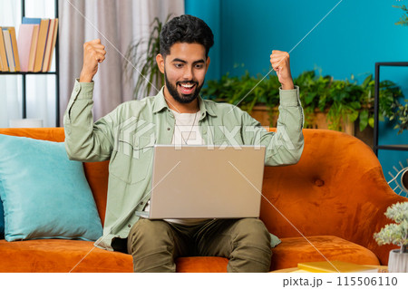 Excited happy Indian man surprised, shocked by sudden victory good win news celebrating wow reaction Excited happy Indian man surprised, shocked by sudden victory good win news celebrating wow reaction 115506110
