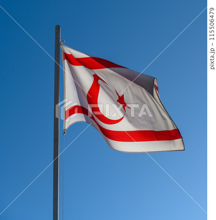 National flag of Turkish Republic of Northern Cyprus on a flagpole 1 115506479