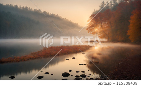 Autumn mist covers serene landscape, reflecting trees in peaceful lake. Tranquil and beautiful. 115508439