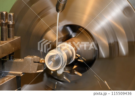The lathe machine finish cut metal shaft parts with liquid coolant method. The lathe machine finish cut metal shaft parts with liquid coolant method. 115509436