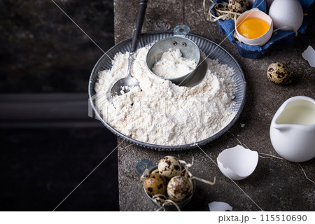 Baking ingredients with flour and eggs 115510690