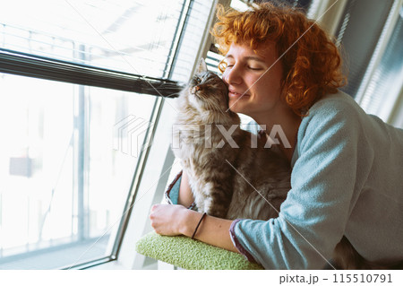 cat mom brushes her furry pet cat mom brushes her furry pet 115510791