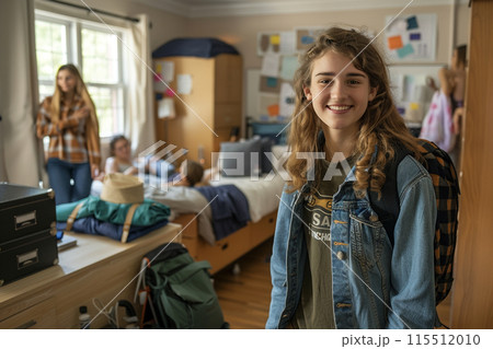 Smiling Teenage Girl in a Busy Dorm Room 115512010