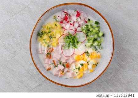 Okroshka smoked chicken breast - Russian cold soup with vegetables on white wooden background. Selective focus Okroshka smoked chicken breast - Russian cold soup with vegetables on white wooden background. Selective focus 115512941