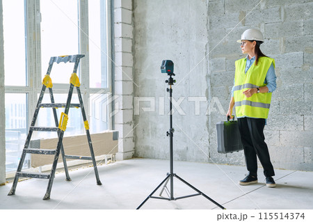 Portrait of female industrial worker builder engineer supervisor at construction Portrait of female industrial worker builder engineer supervisor at construction 115514374