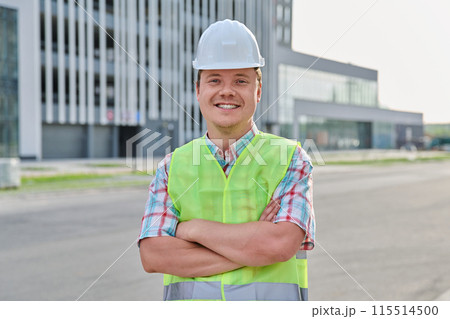 Young confident male engineer, builder, industrial worker at construction site Young confident male engineer, builder, industrial worker at construction site 115514500