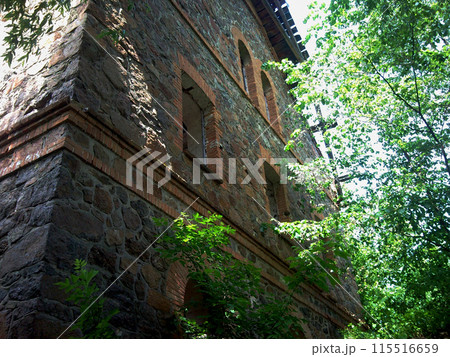 Old water mill.Stone building for grinding grain into flour. The reverse side of the building overlooks the Southern Bug River.The building has been completely abandoned since the 2000s. Old water mill.Stone building for grinding grain into flour. The reverse side of the building overlooks the Southern Bug River.The building has been completely abandoned since the 2000s. 115516659