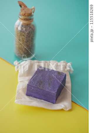 Homemade natural soap bar and lavender flower on table  115518269