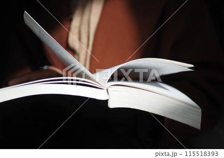 Close up of women hand turning a pager of a diary Close up of women hand turning a pager of a diary 115518393