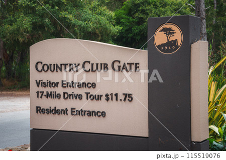 Explore the Country Club Gate sign at the entrance point to a 17 Mile Drive Tour in California. Visitor entrance fee is dollars11.75. Rich in history and lush greenery. 115519076