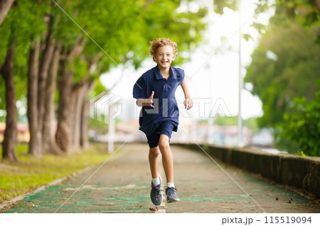 Kids run in summer park. Active child running. Kids run in summer park. Active child running. 115519094