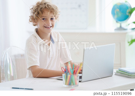 Child in school. Student in class. Boy at homework Child in school. Student in class. Boy at homework 115519096