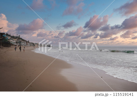 Serene beach scene at Californian coastline, likely 17 Mile Drive. Soft lighting, pastel sky, gentle waves, people enjoying water activities, picturesque coastal view. Serene beach scene at Californian coastline, likely 17 Mile Drive. Soft lighting, pastel sky, gentle waves, people enjoying water activities, picturesque coastal view. 115519141